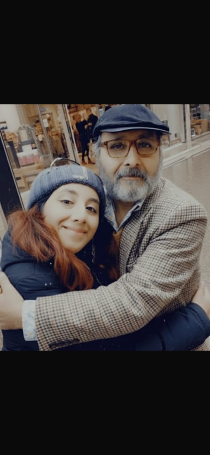 A treasured photograph of a daughter embracing her dad